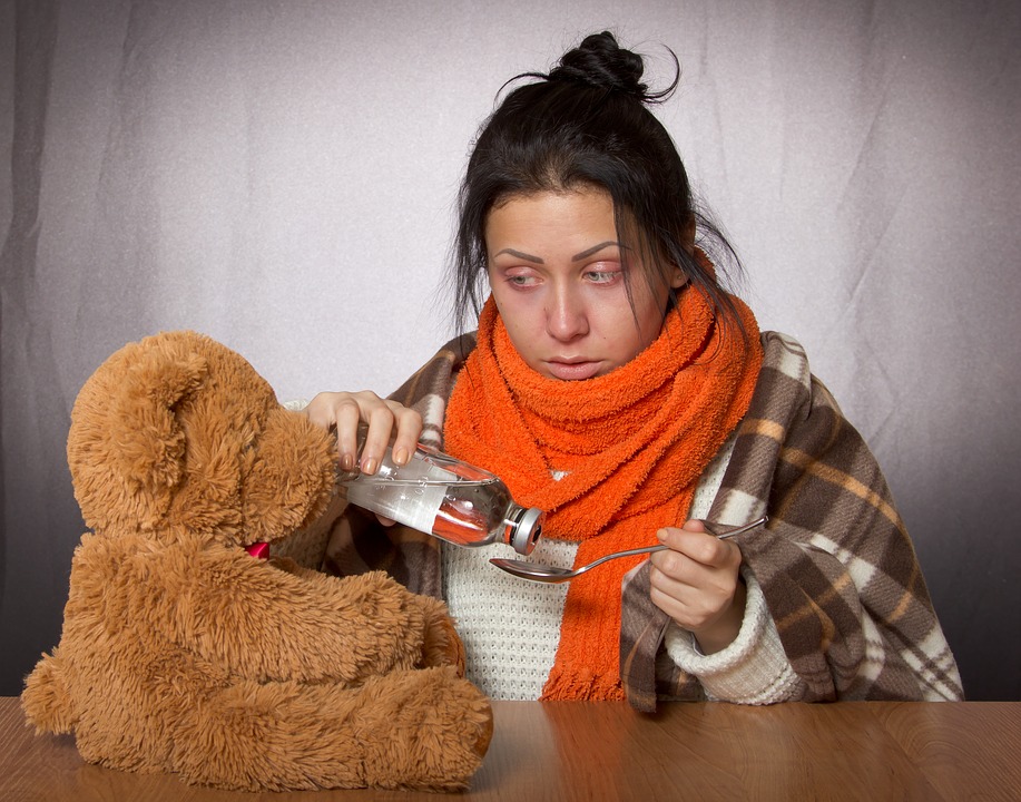 woman with flu medicine